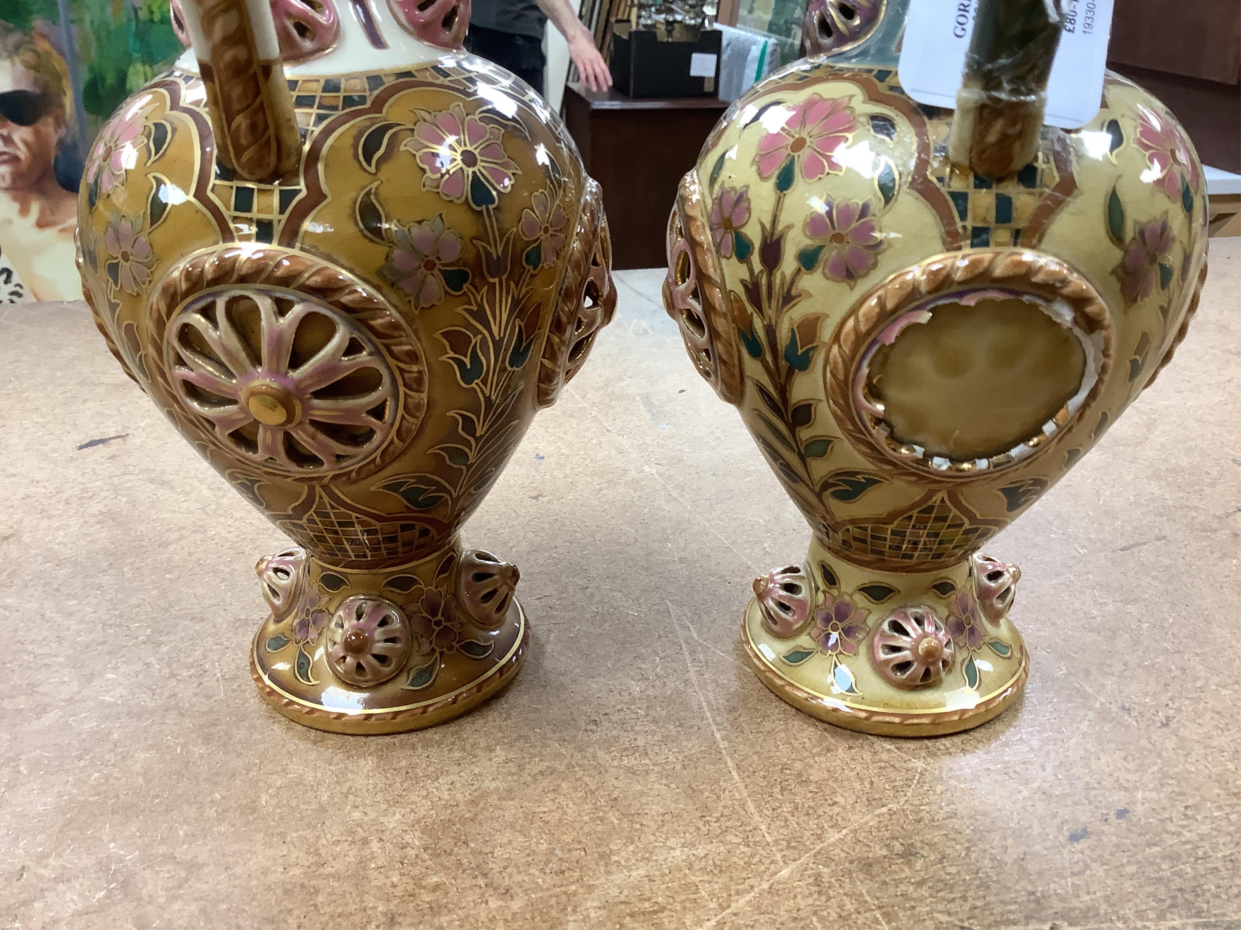 Two Zsolnay Persian inspired jugs / ewers and covers, stamped to the bases 29cm high